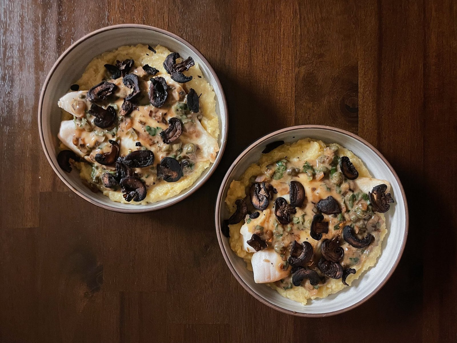 Fish Poached in Herb-Wine Sauce with Polenta and Crispy Mushrooms