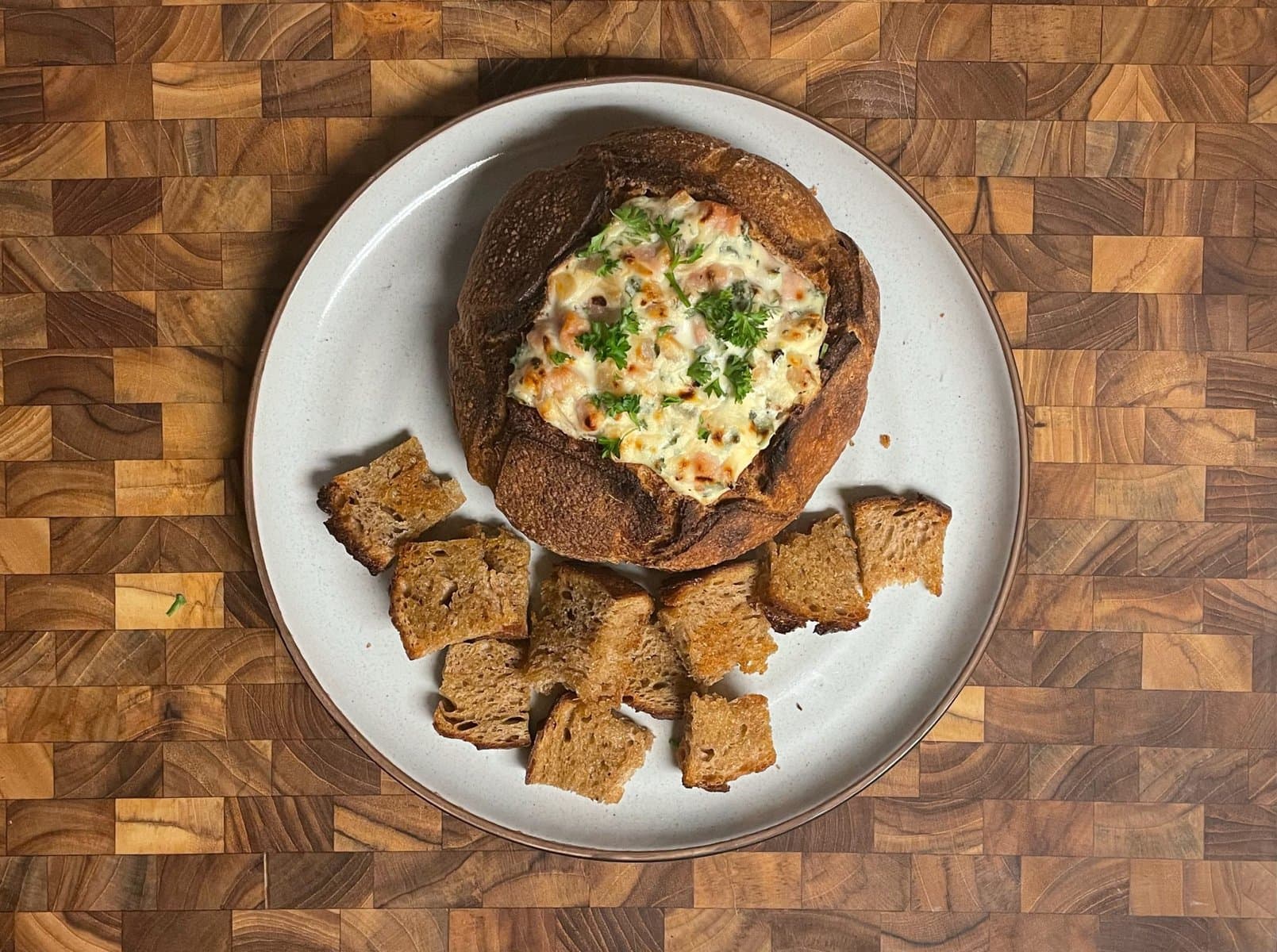 Lemony Baked Ricotta and Goat Cheese Bread Bowl Dip